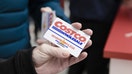 A customer shows their membership card in this arranged photograph inside a Costco Wholesale Corp.&nbsp;store in Villebon-sur-Yvette, France, on Friday, Nov. 3, 2017. About an hour south of Paris, a uniquely American import has opened for business. Photographer: Marlene Awaad/Bloomberg via Getty Images