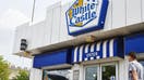 A customer walks towards the entrance of a White Castle restaurant in the Sunnyside neighborhood in the Queens borough of New York, U.S., on Wednesday, July 31, 2019.