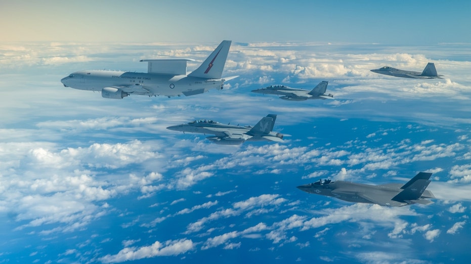 Australian Wedgetail flying in formation with American fighters