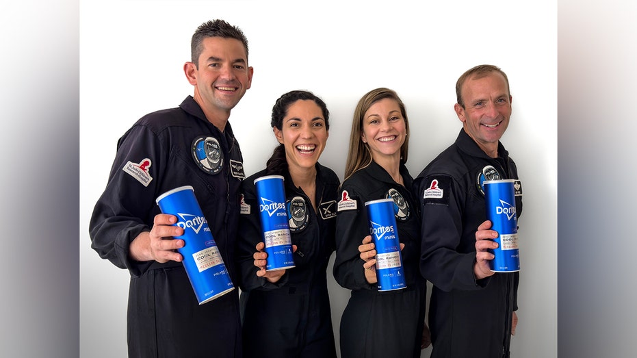 Astronauts posing with Zero Gravity Doritos