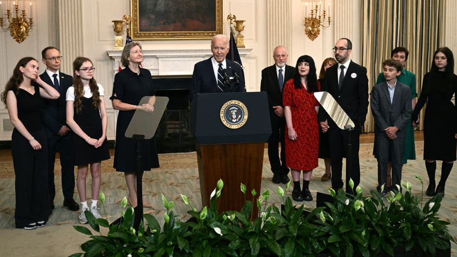 President Biden, standing alongside family members of the freed prisoners, speaks about the prisoner exchange with Russia