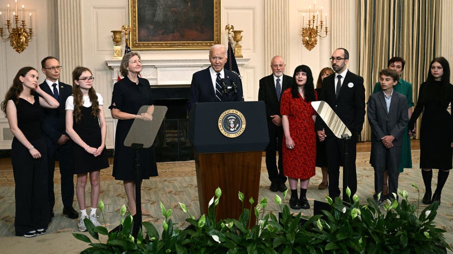 President Biden, standing alongside family members of the freed prisoners, speaks about the prisoner exchange with Russia