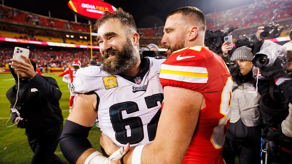 Jason and Travis Kelce on the field