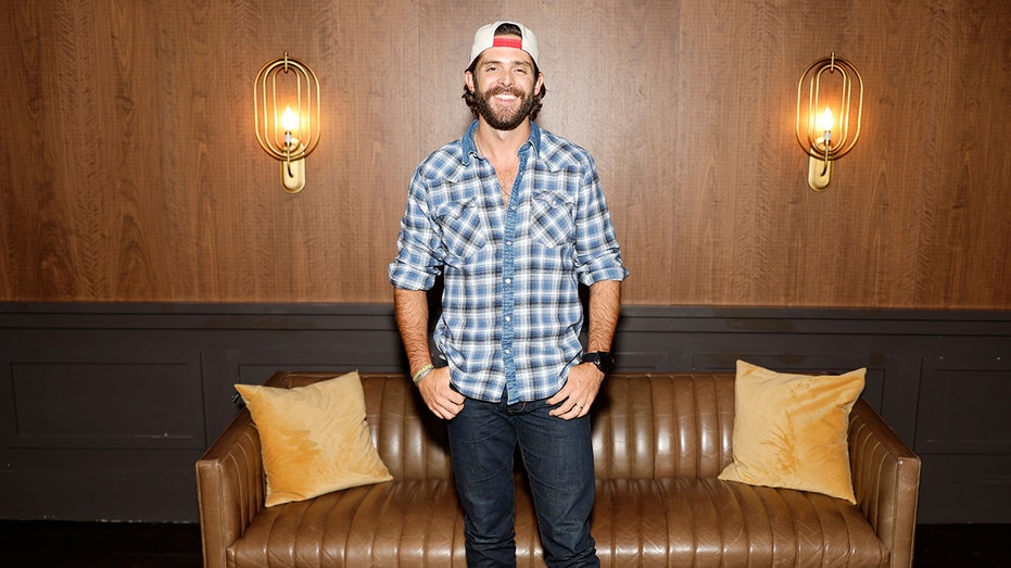 Thomas Rhett posing and smiling