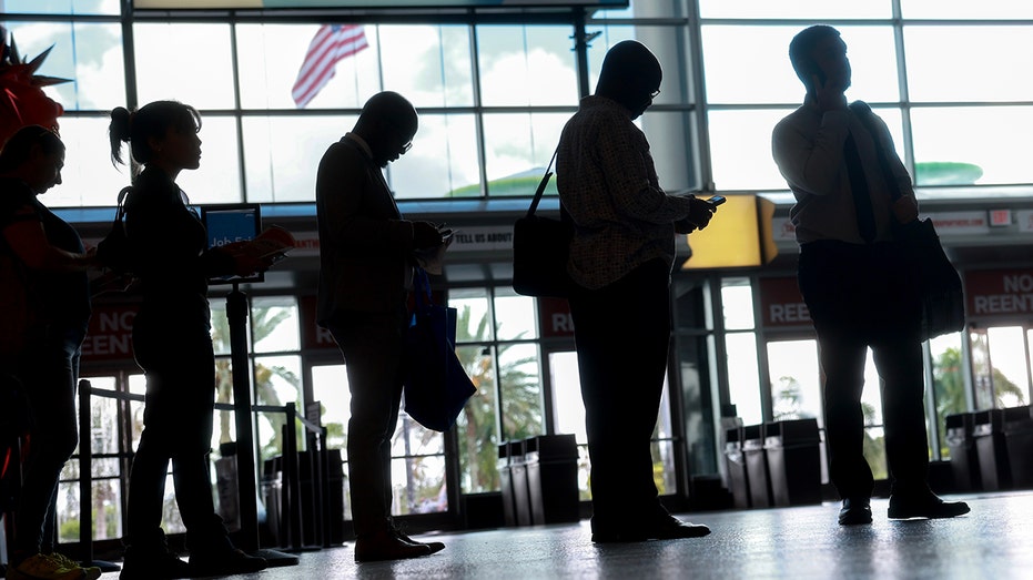 People wait in the job fair line