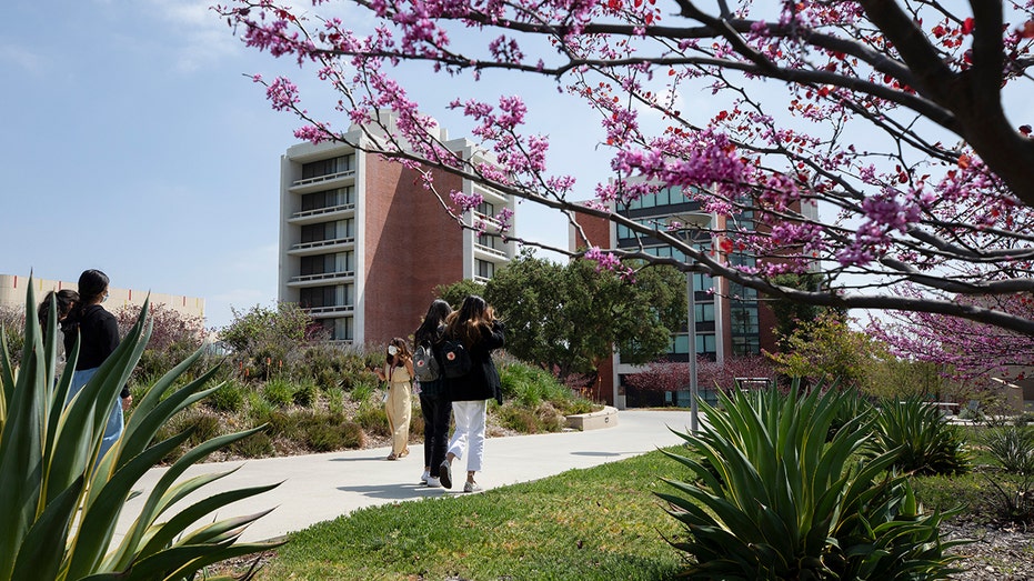 CLAREMONT, CA - APRIL 12: A campus tour takes place at Claremont McKenna College on Monday, April 12, 2021 in Claremont, CA. The school has reopened in-person tours after shutting them down last year amid the pandemic. The college tour is a key aid in helping students make their big decisions. (Myung J. Chun / Los Angeles Times via Getty Images)