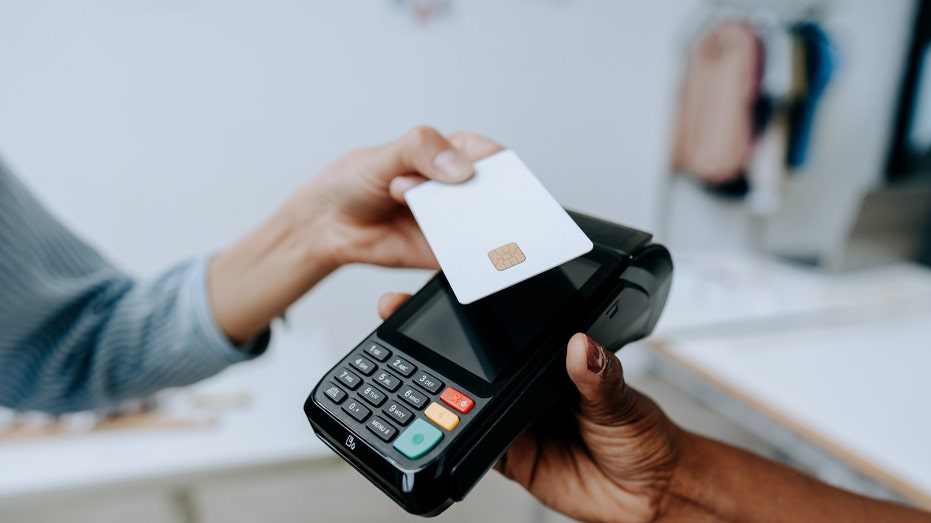 Individual making a credit card payment