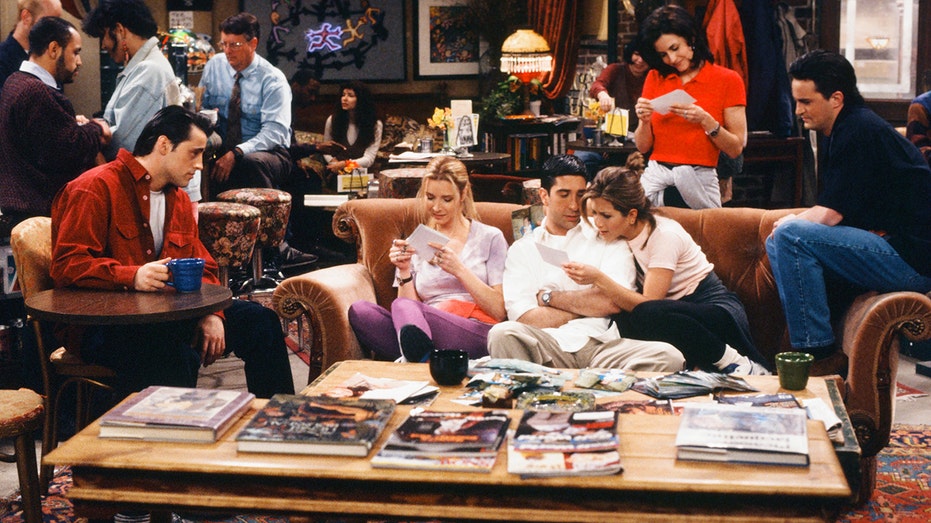 The cast of "Friends" filming a scene on the Central Perk set.