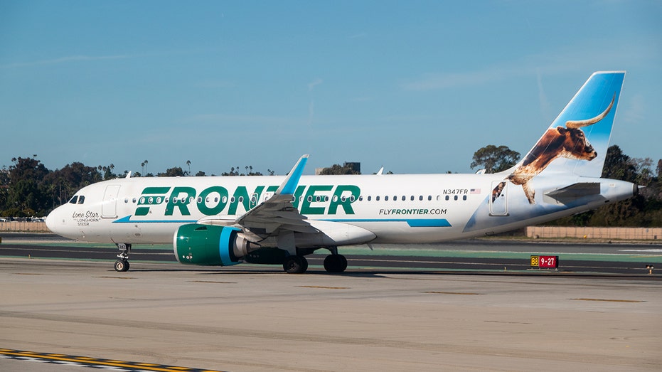 Longhorn steer Frontier Airlines plane in San Diego