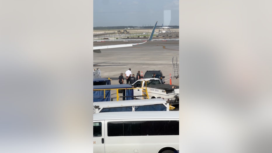 Frontier pilot in handcuffs