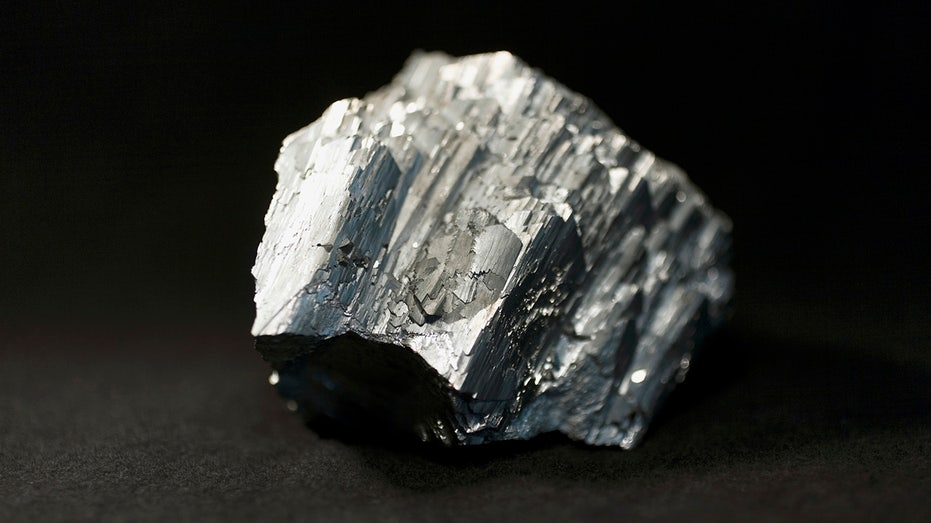 A piece of arsenic, a silvery looking mineral.