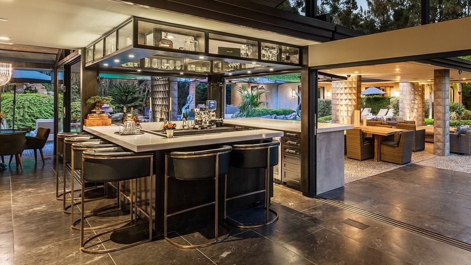 One of the main highlights of the home is the indoor outdoor bar.