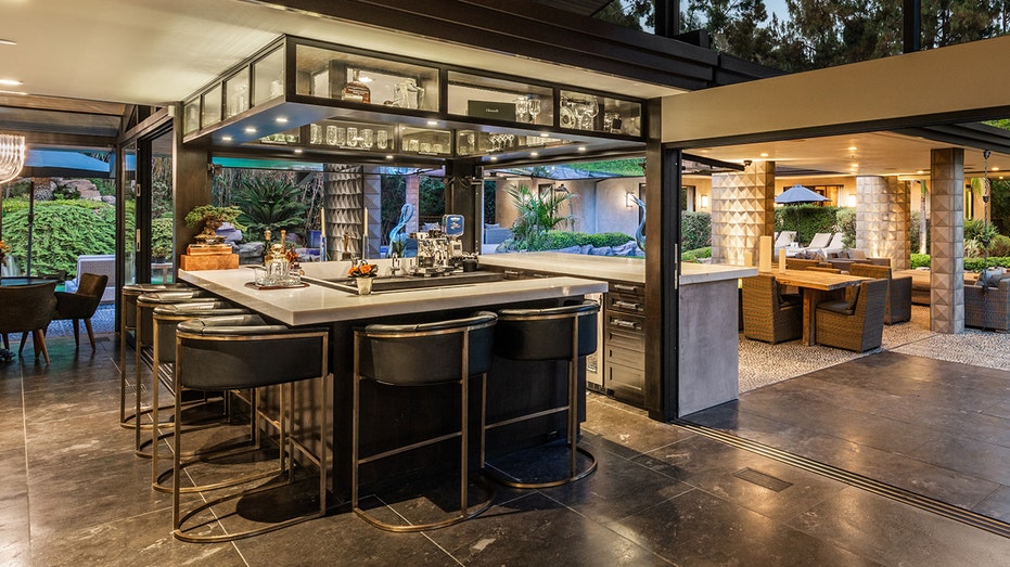 One of the main highlights of the home is the indoor outdoor bar.