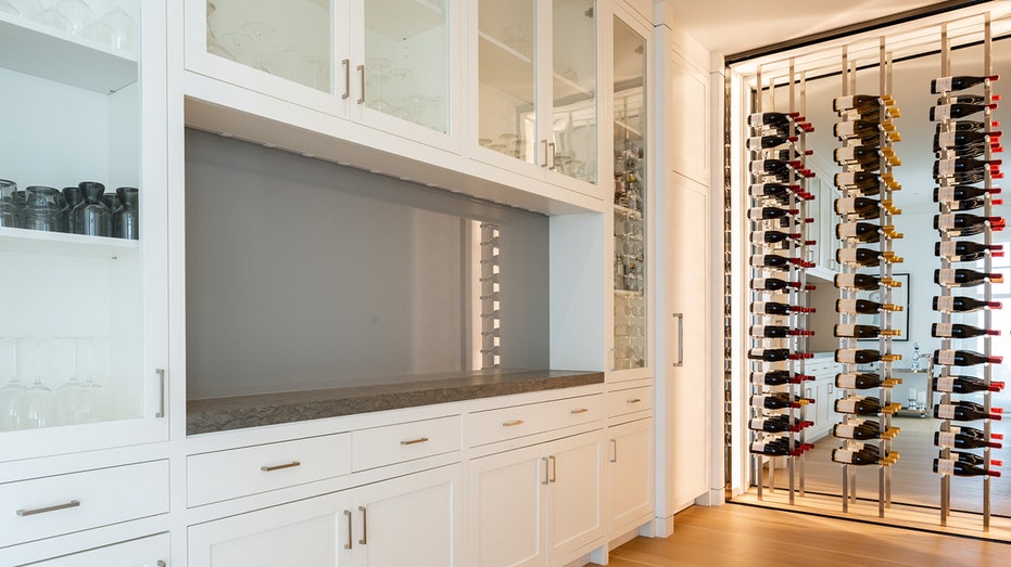 The kitchen also features a wine rack and cooler.