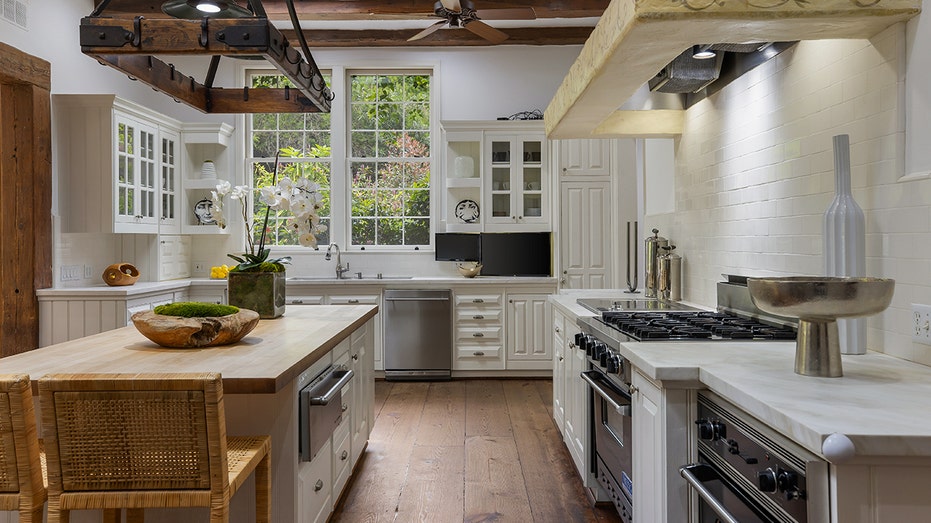 White kitchen with stainless steel appliances