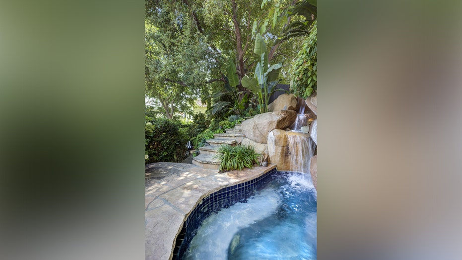 Just a few steps from the outdoor seating area are the waterfall and small pool.