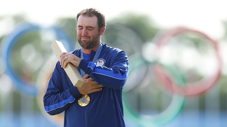 Scottie Scheffler lets emotions flow during national anthem after gold