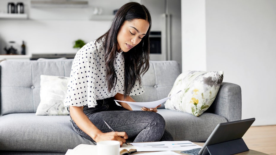 A woman creating a budget