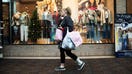 A shopper carries bags at the Polaris Fashion Place mall on Black Friday in Columbus, Ohio, US, on Friday, Nov. 24, 2023. An estimated 182 million people are planning to shop from Thanksgiving Day through Cyber Monday, the most since 2017, according to the National Retail Federation. Photographer: Matthew Hatcher/Bloomberg via Getty Images