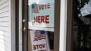 &quot;Vote Here&quot; signs outside a polling station in East Lansing, Michigan, US, on Thursday, Aug. 1, 2024. Three federal judges on Friday approved a new Michigan Senate map, changing the boundaries of fourteen districts after saying an independent commission that drew it corrected the problems of six Detroit-area districts that previously included illegal racial gerrymandering