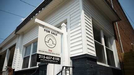 A "For Sale" sign on a house in Philadelphia, Pennsylvania, US, on Friday, Aug. 16, 2024. 