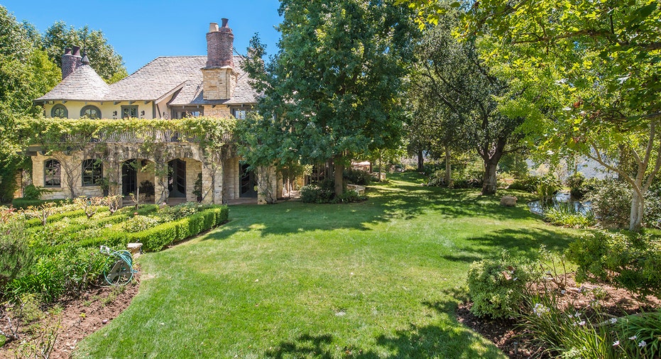 Exterior of the home with luscious green lawn