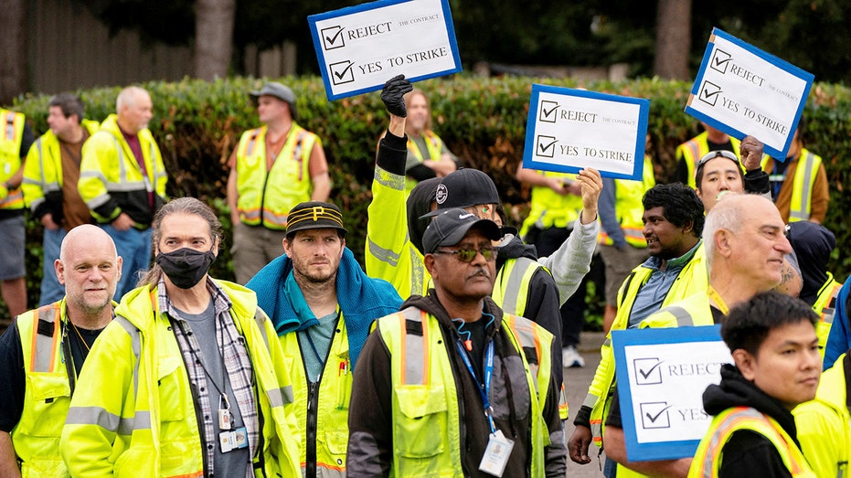 Workers with signs