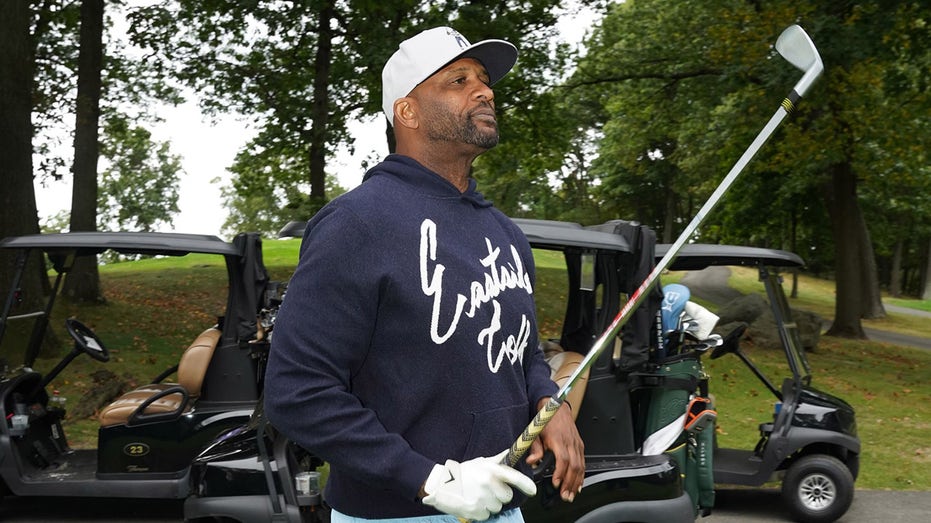 CC Sabathia walks the golf course