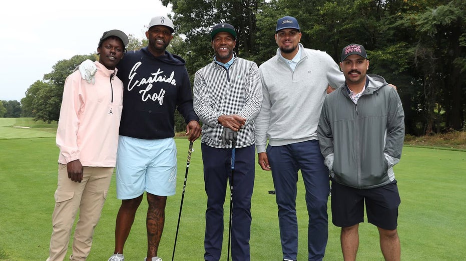 Jazz Chisholm Jr., CC Sabathia, Michael Strahan, Dellin Betances and Nestor Cortes Jr. on golf course