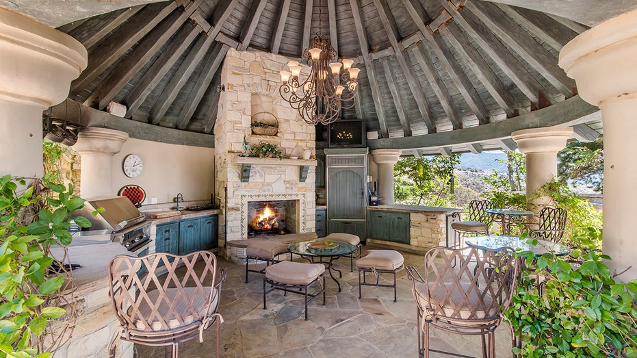 outdoor grill space underneath a rotunda with beams