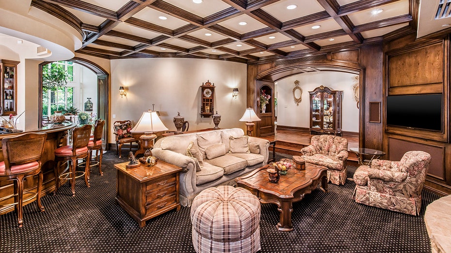 a living space with checkered beamed ceilings