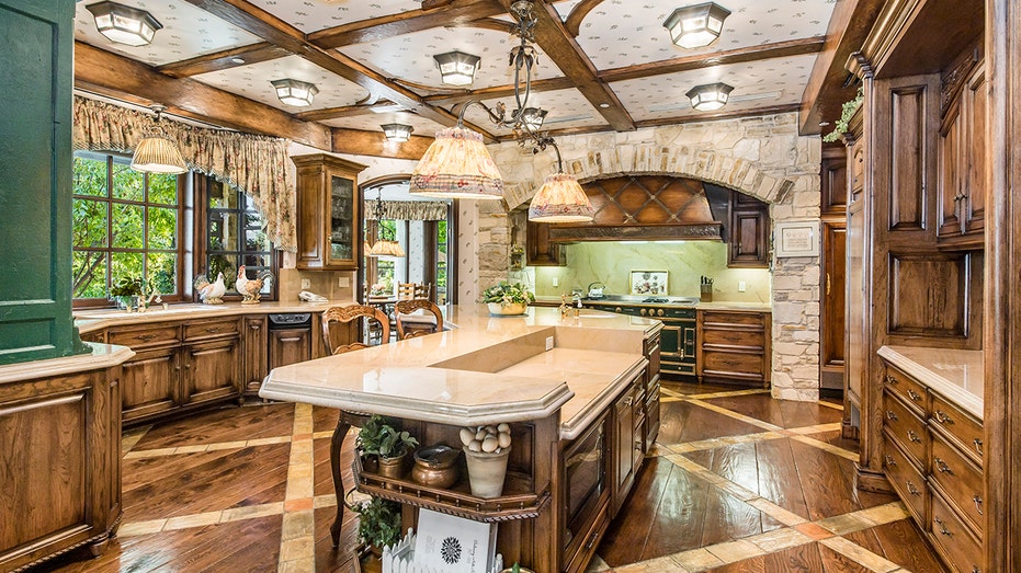 the kitchen with green accents