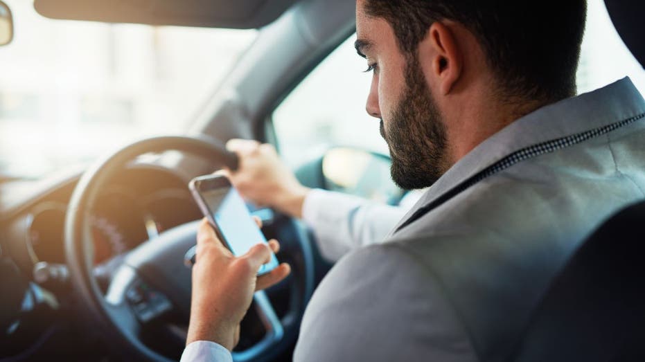 Man texting while driving