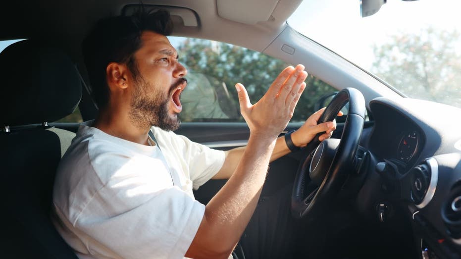 Angry man yelling in car