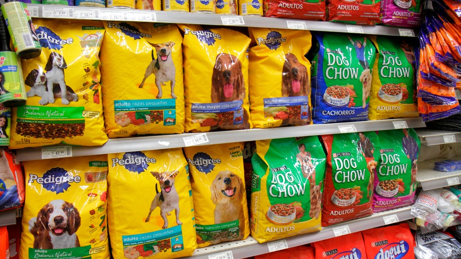 Bags of dog food on shelf