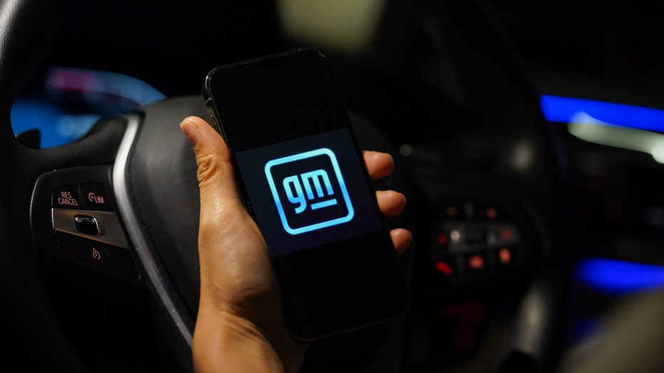 GM logo on smartphone