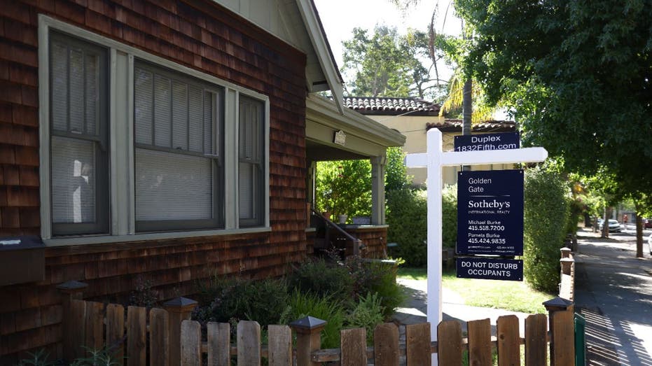 house with a for sale sign