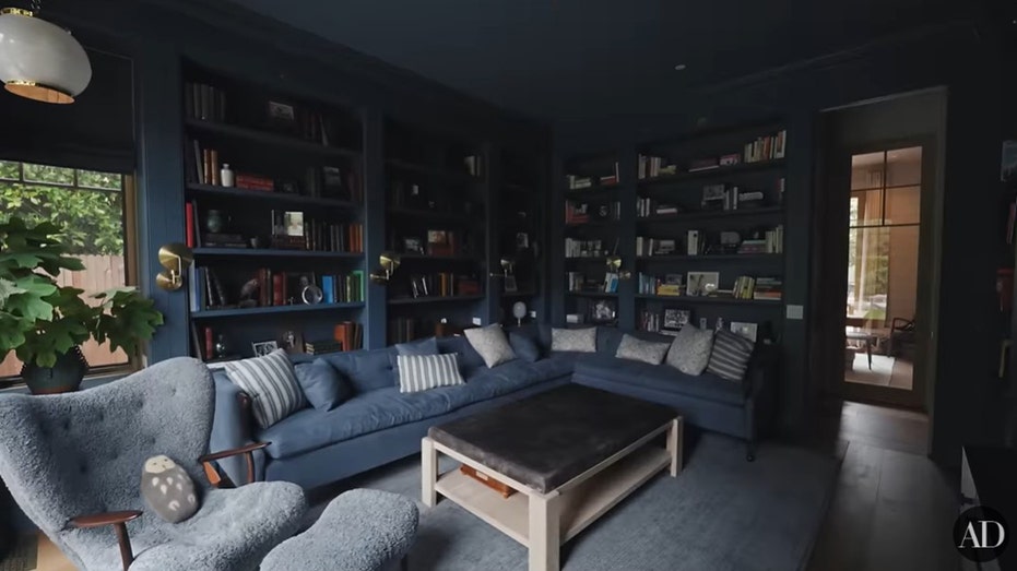 Garner's home features an all-blue cozy library with built-in bookshelves.