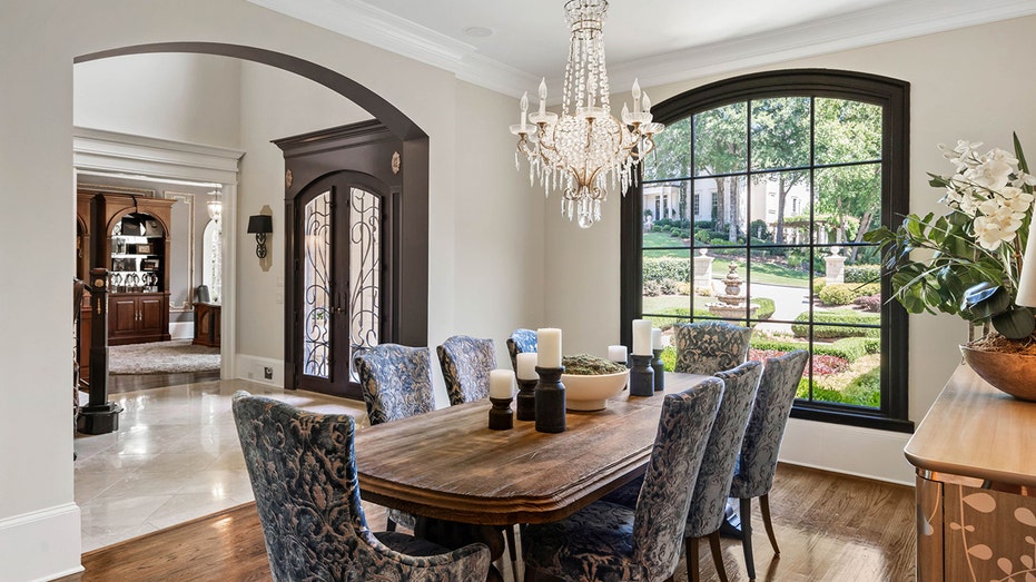 The dining room features a window looking out into the front yard and is big enough for a table fit for eight.