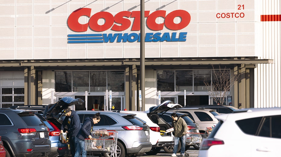 Shoppers load their cars in front of a NJ Costco