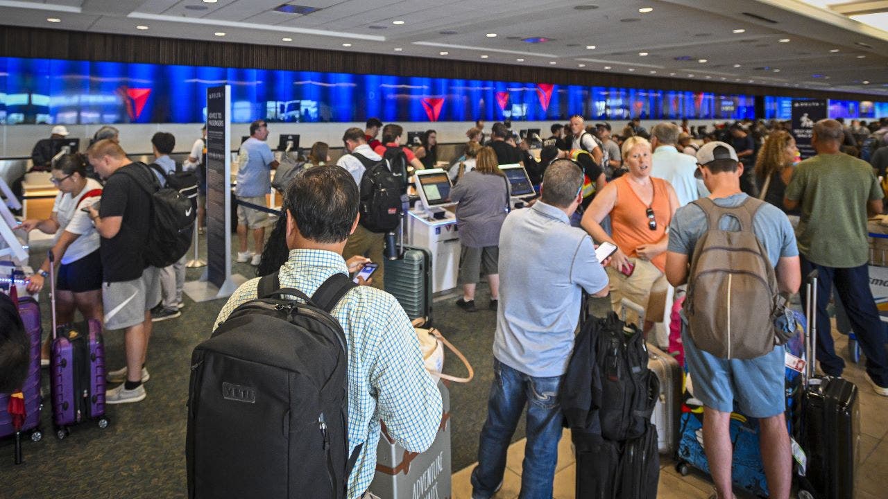 Travelers at an airport terminal navigating scams in the digital age