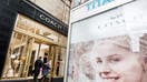 Shoppers are seen at the entrance to a Coach Inc. store in New York, U.S., on Thursday, Jan. 22, 2015. Coach Inc. is expected to release earnings figures on January 26. 