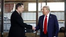 BUTLER, PENNSYLVANIA - OCTOBER 05: Elon Musk (L) shakes hands with Republican presidential nominee, former President Donald Trump back stage during a campaign rally at the Butler Farm Show grounds on October 05, 2024 in Butler, Pennsylvania. This is the first time that Trump has returned to Butler since he was injured during an attempted assassination on July 13.