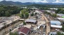 ASHEVILLE, NORTH CAROLINA - OCTOBER 03: An aerial view of flood damage wrought by Hurricane Helene along the Swannanoa River on October 3, 2024 in Asheville, North Carolina. At least 200 people were killed in six states in the wake of the powerful hurricane which made landfall as a Category 4. President Joe Biden took an aerial tour of the devastated region yesterday and ordered the deployment of 1,000 active duty U.S. soldiers to assist with storm relief efforts and reinforce the North Carolina National Guard. 