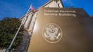 WASHINGTON, D.C. - JANUARY 03: The U.S. Flag flys above the International Revenue Service headquarters building on January 3, 2024, in Washington, D.C. 