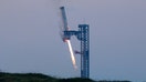 SpaceXs Super Heavy booster lands during SpaceX Starships fifth flight test, in Boca Chica, Texas, U.S., October 13, 2024.  REUTERS/Kaylee Greenlee Bea    REFILE  - CORRECTING INFORMATION FROM &quot;LIFTS OFF&quot; TO &quot; LANDS&quot; AND &quot;STARSHIP&quot; TO &quot;SUPER HEAVY BOOSTER&quot;