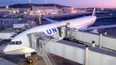 A United Airlines plane is seen at the gate during sunrise at San Francisco International Airport on Oct. 19. 