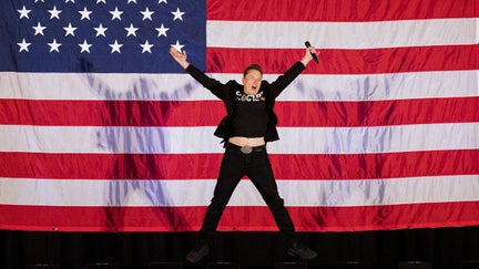 Tesla and SpaceX CEO Elon Musk jumps on stage as he arrives to speak at a town hall event hosted by America PAC in support of Donald Trump in Philadelphia. (Photo by Ryan Collerd/AFP via Getty)