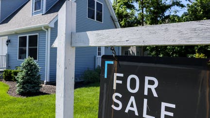 Patchogue, N.Y.: A For Sale sign hangs in front of a house in Patchogue, New York, on June 1, 2024.