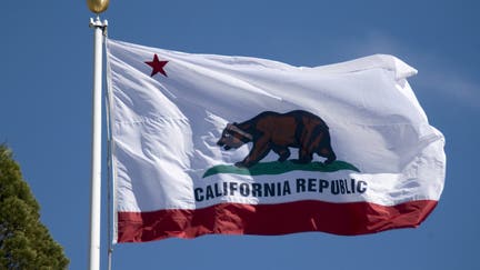 The California State flag flutters on flag pole in California USA (Photo by Nik Wheeler/Corbis via Getty Images)